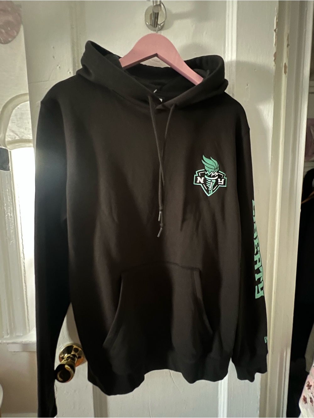 New Era Black Hoodie with Mint Green Logo and Sleeve Print